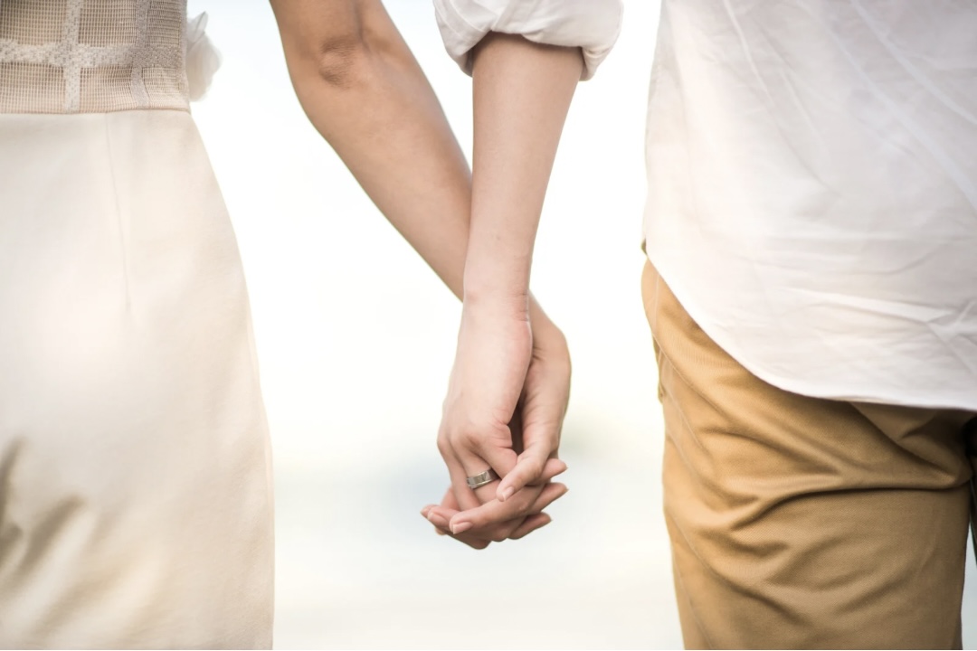 Couple holding hands and rebuilding trust in a relationship