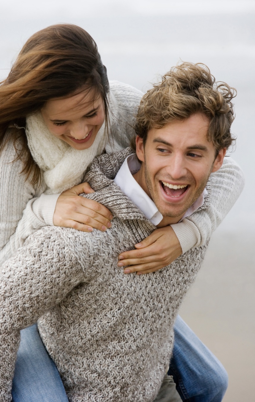 Couple reconnecting and laughing together while rebuilding friendship in their relationship with couples therapy in Denver and Los Angeles